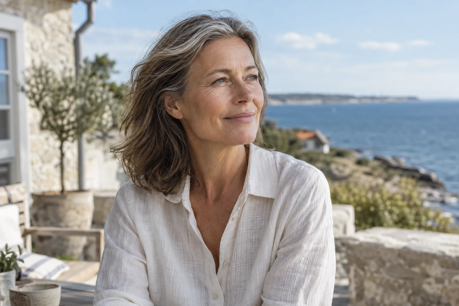 A woman enjoying a quiet moment by the sea. AI-generated editorial illustration.